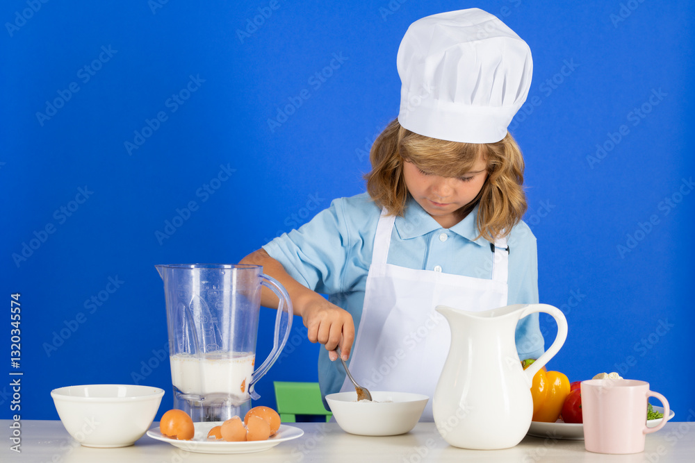 Cooking children. Chef kid boy making fresh vegetables for healthy eat. Portrait of little child in form of cook isolated on blue background. Kid chef. Cooking process. Cooking children. Chef kid boy making fresh vegetables for healthy eat. Portrait of little child in form of cook isolated on blue background. Kid chef. Cooking process.