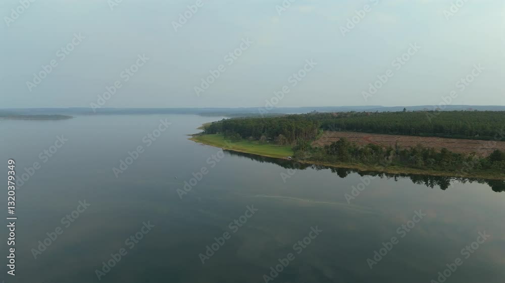 A captivating aerial view from a drone, showcasing the tranquil waters of a lake in the Uruguaí area of Misiones, Argentina. A captivating aerial view from a drone, showcasing the tranquil waters of a lake in the Uruguaí area of Misiones, Argentina.