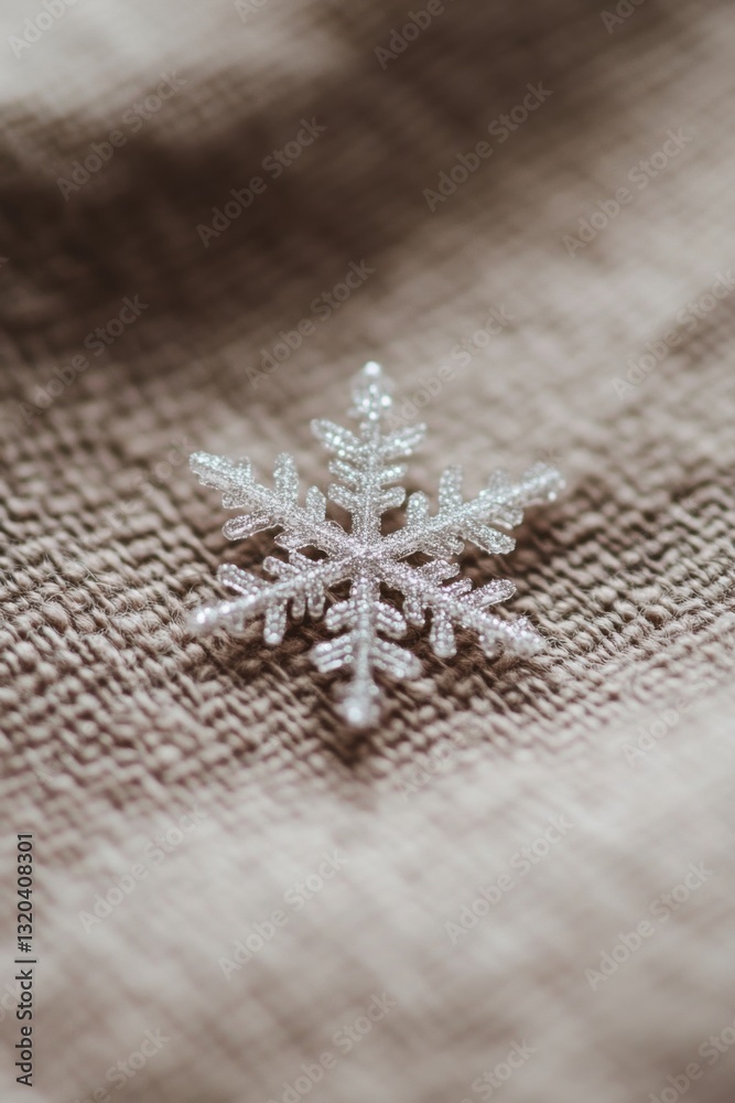 Delicate snowflake resting on a soft fabric showcasing minimalist beauty and intricate details