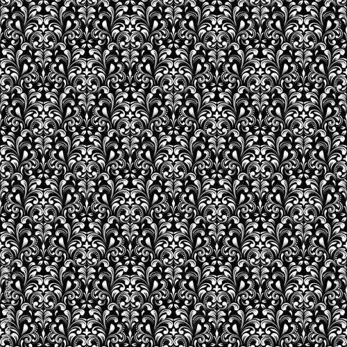 Floral pattern. Seamless vector background. Vintage wallpaper in the Baroque style. White and black ornament for fabric, wallpaper, packaging. Ornate Damask flower illustration.