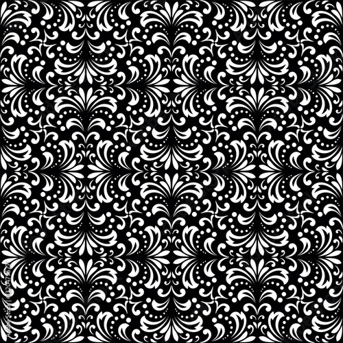 Floral pattern. Seamless vector background. Vintage wallpaper in the Baroque style. White and black ornament for fabric, wallpaper, packaging. Ornate Damask flower illustration.