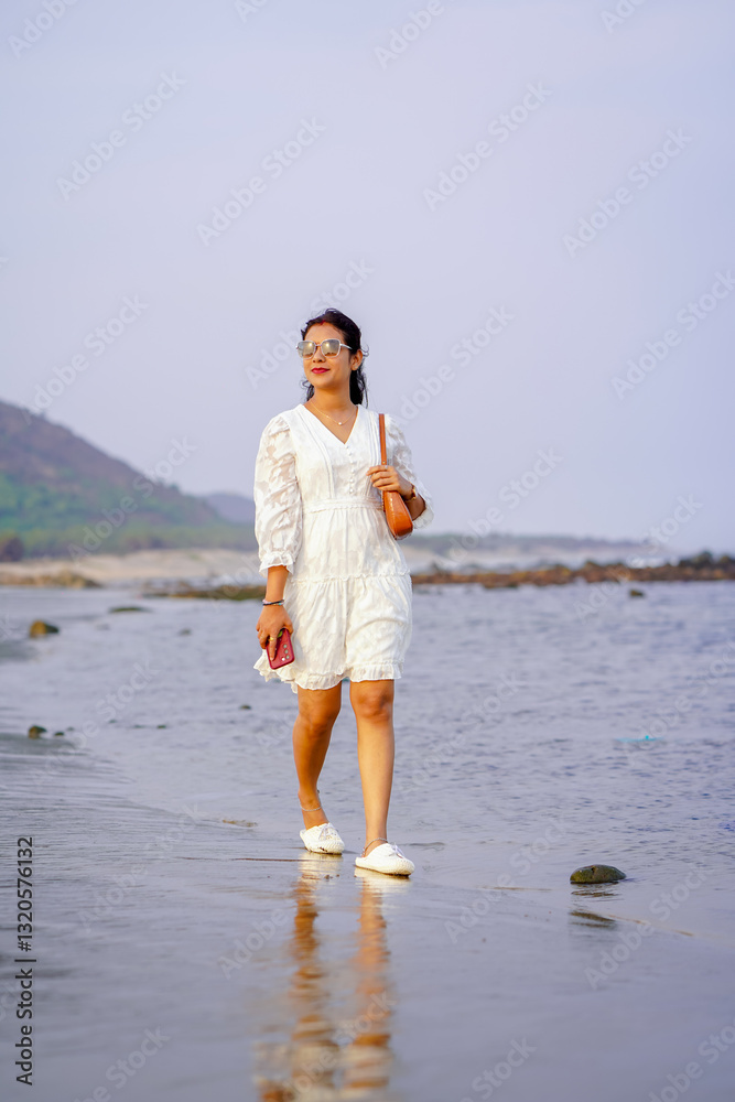 Beachwalk elegance, Woman in white on shore, Coastal fashion moment, Waves and wanderlust, Ocean breeze stroll, Sunset beach vibes, Seaside style shoot stock photo.
Beachwalk elegance, Woman in white on shore, Coastal fashion moment, Waves and wanderlust, Ocean breeze stroll, Sunset beach vibes, Seaside style shoot stock photo.