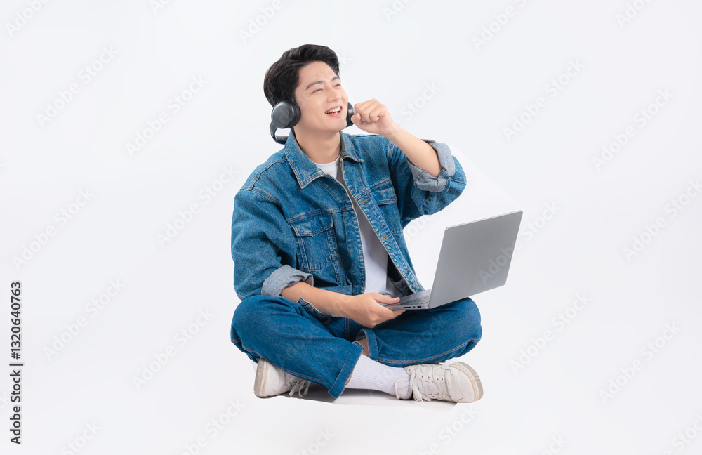 Full body image of Asian guy using laptop listen on white background Full body image of Asian guy using laptop listen on white background