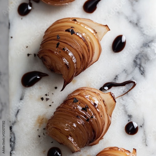 Top view of caramelized onion on marble background with balsamic glaze elegant food presentation