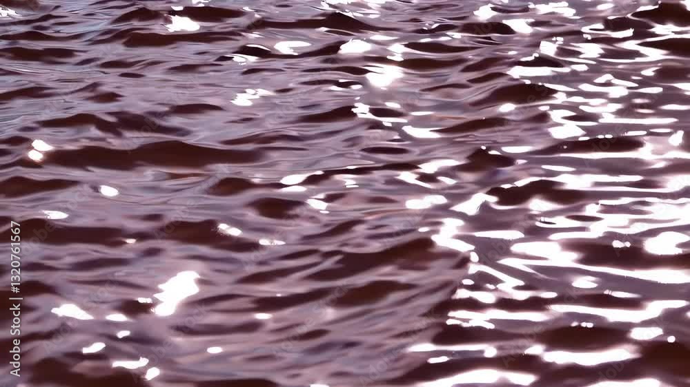 Rippling chocolate liquid surface: dynamic movement and reflections in high resolution
