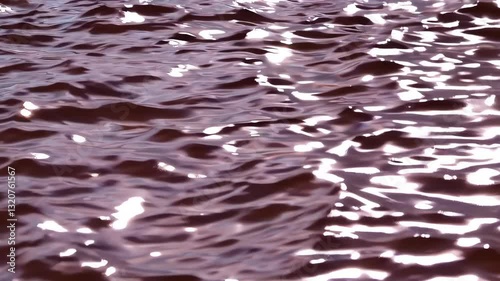 Rippling chocolate liquid surface: dynamic movement and reflections in high resolution