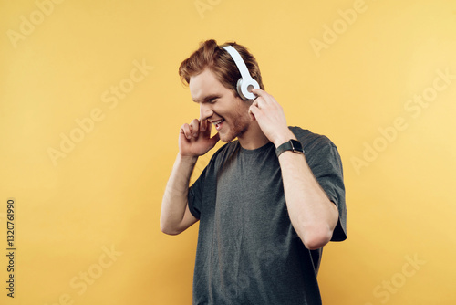 Portrait of Happy Smiling Guy Listening to Music