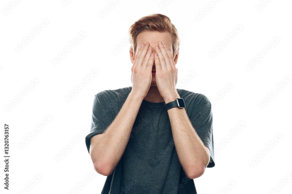Shocked Young Man Covering Head Eyes with Hand Shocked Young Man Covering Head Eyes with Hand