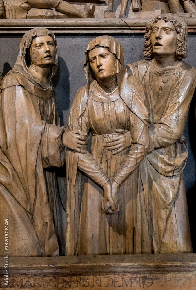 Fototapeta premium Puget Theniers, FRANCE, 02-17-2025: Wood sculpture (19th century) of Virgin Mary at the entombment of Christ.