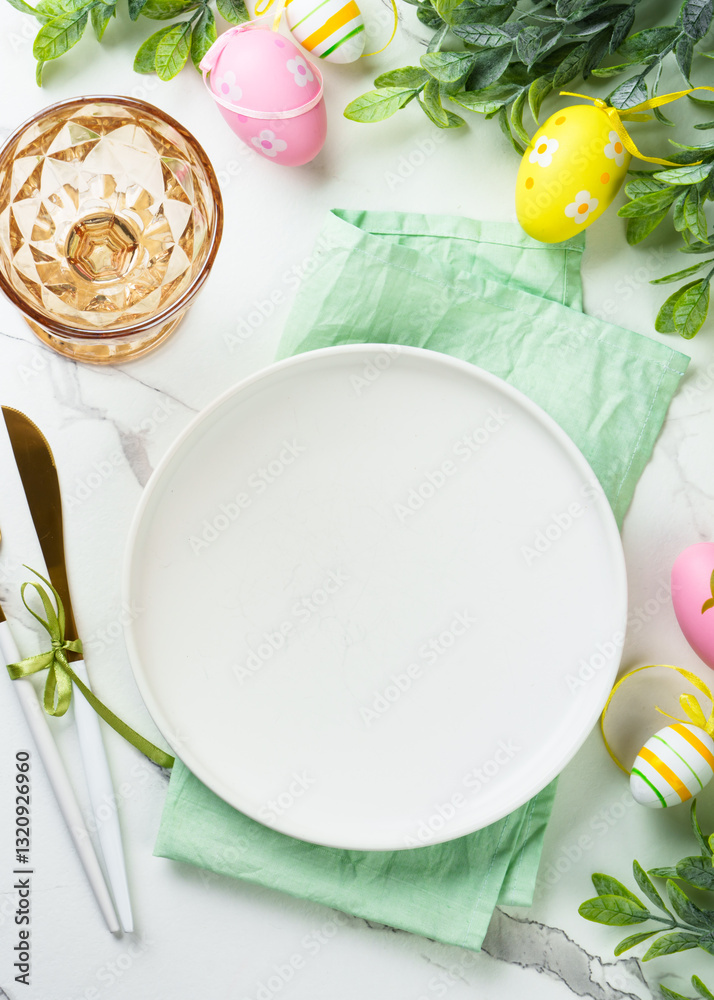 Easter table setting with cute decorations at white background.