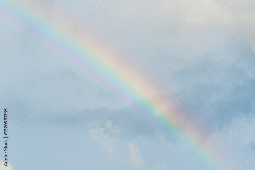 Dramatic blue clouds and rainbow in sunset sky. Amazing sky landscape. The sky that gives happiness and peace Dramatic blue clouds and rainbow in sunset sky. Amazing sky landscape. The sky that gives happiness and peace