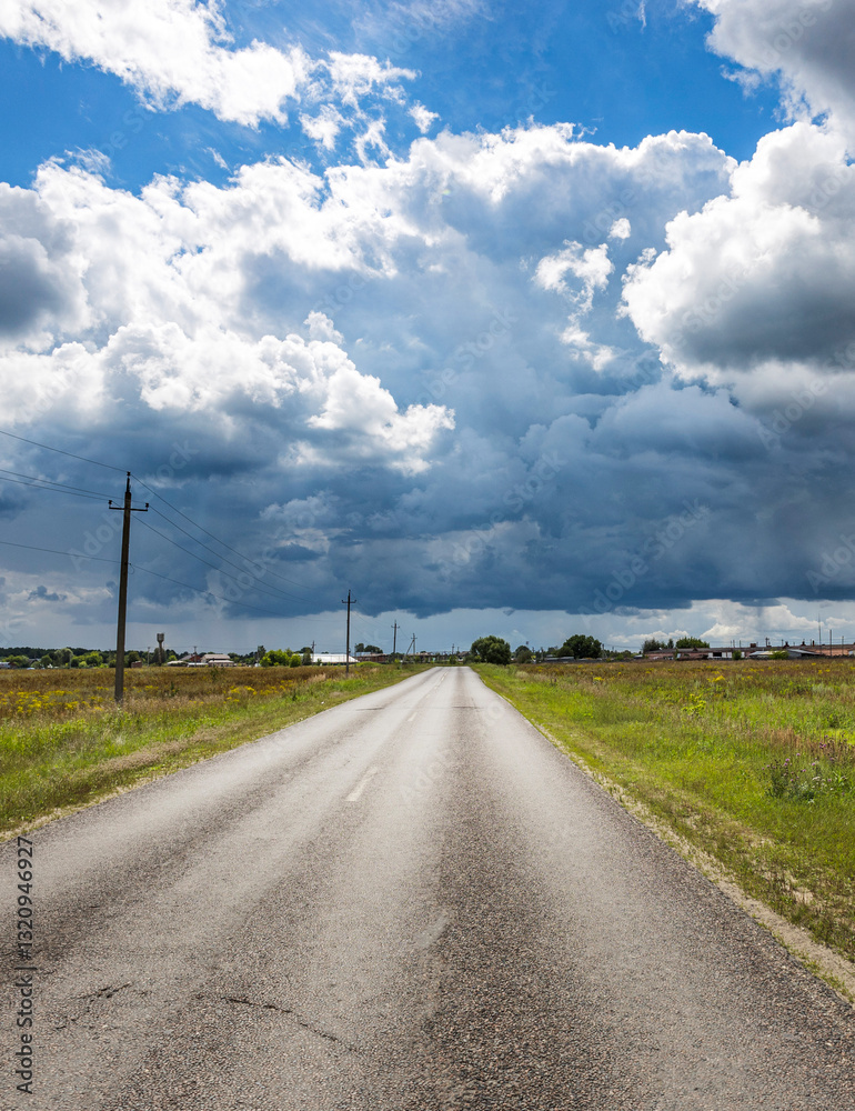Road with a cloudy sky in the background Road with a cloudy sky in the background