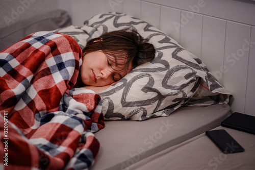 Peaceful Woman Sleeping Under Warm Plaid Blanket
