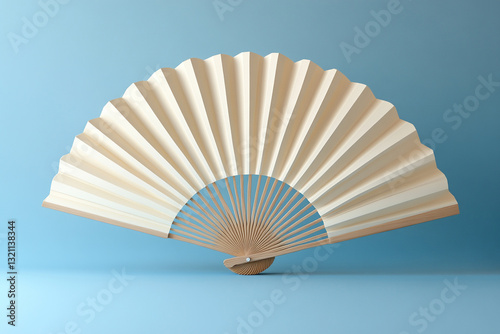 Open white fan with wooden base on blue background.
