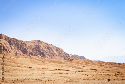 Rugged, arid landscape in eastern Iran, the Middle East. Mountains and vast plains.