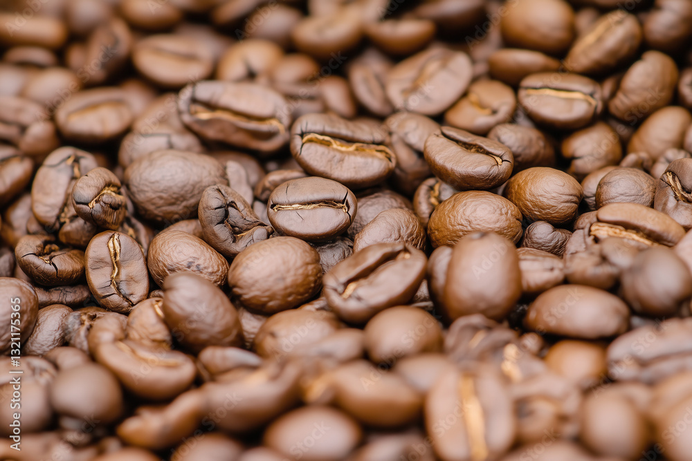 Close-up shows pile of fresh roasted coffee beans ready to be ground for a delicious brew. Close-up shows pile of fresh roasted coffee beans ready to be ground for a delicious brew.