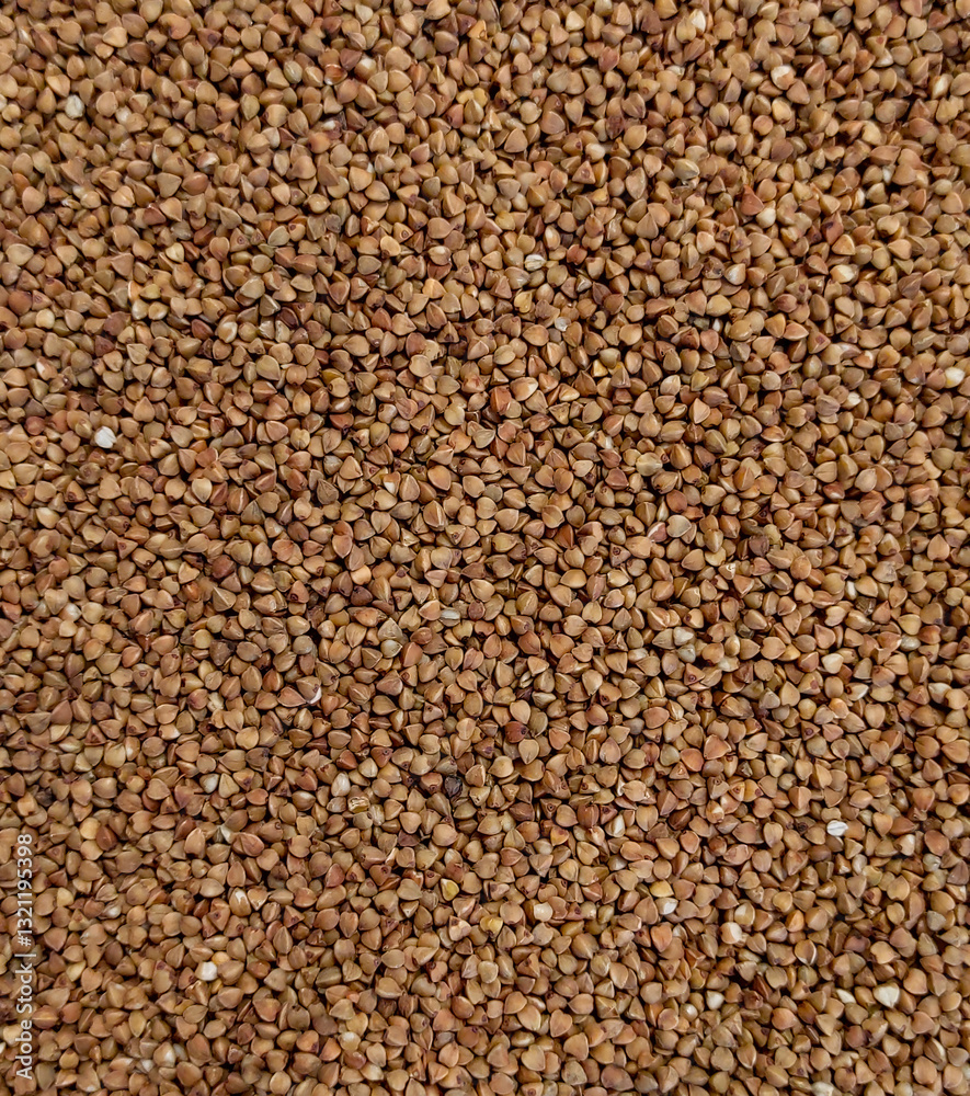 A high-resolution close-up of raw buckwheat grains, showcasing their natural texture, earthy brown tones, and organic quality A high-resolution close-up of raw buckwheat grains, showcasing their natural texture, earthy brown tones, and organic quality