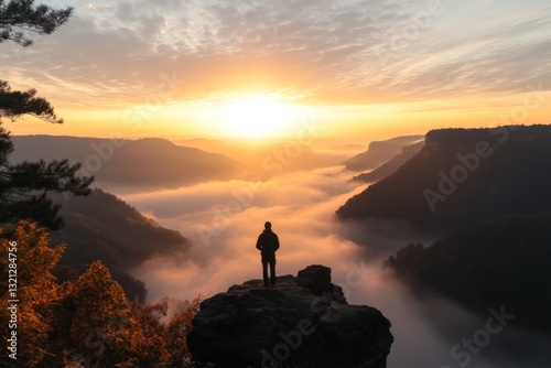 Wallpaper Mural Majestic sunrise view from a rocky cliff overlooking a foggy valley at dawn in a serene natural landscape Torontodigital.ca