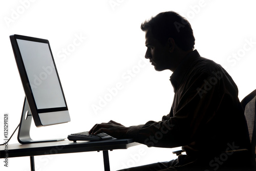 Silhouette of a man working on computer