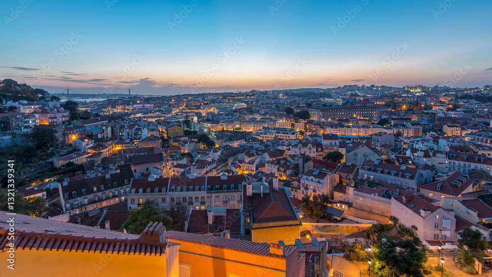 Obraz premium Lisbon panorama after sunset aerial view of city centre with red roofs at autumn day to night timelapse, Portugal