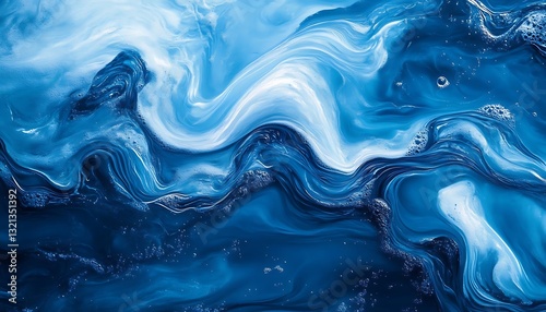 Abstract blue and white liquid paint swirls.