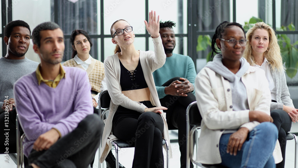 Woman raised up hands and arms in seminar class room to agree with speaker at conference seminar meeting room Woman raised up hands and arms in seminar class room to agree with speaker at conference seminar meeting room