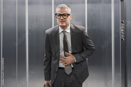Business executive suffering from stomach ache