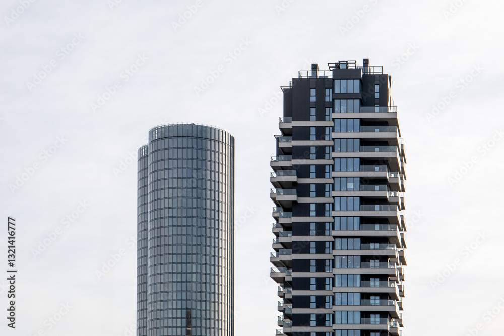 Modern Urban Skyscrapers with Glass Facades and Balconies in a City Landscape Modern Urban Skyscrapers with Glass Facades and Balconies in a City Landscape