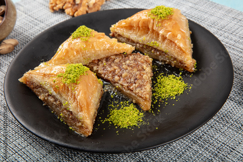 Traditional Turkish Dessert Pistachio Baklava (Fistikli Baklava) Traditional Middle Eastern Flavors. Traditional Turkish baklava. local name fistikli baklava photo