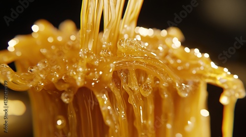 Golden Honey: A Close-Up of Dripping Sweetness photo