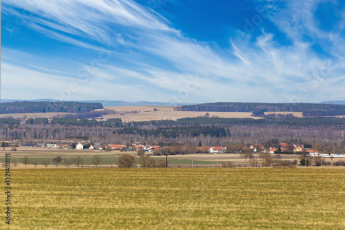 Forests, fields, and villages on the horizon in early spring. Central Europe