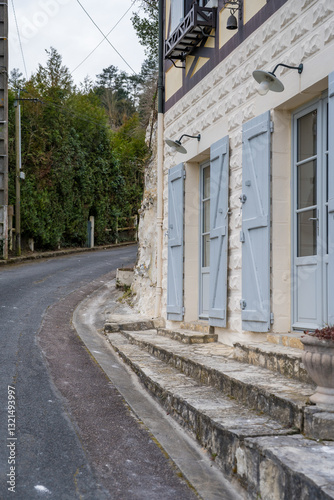 Fototapeta Naklejka Na Ścianę i Meble -  Charming streets of La Roche-Guyon invite leisurely exploration through quaint architecture and winding pathways at sunset
