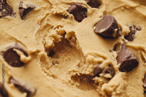 Raw chocolate chip cookie dough texture close up detail background.