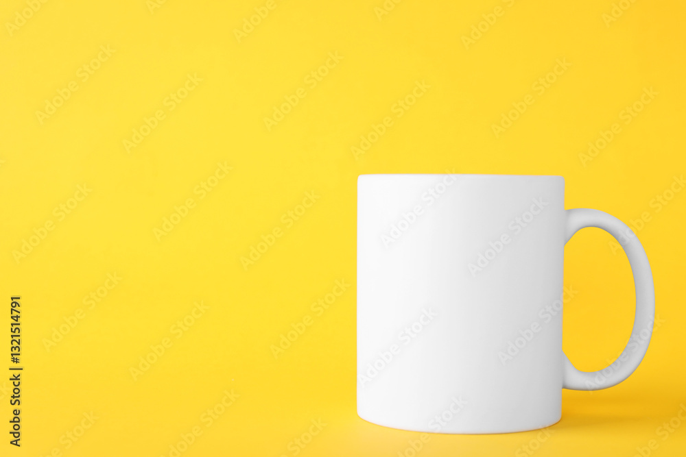 One blank white mug on yellow background. Mockup for design One blank white mug on yellow background. Mockup for design