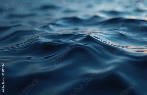 Dramatic slow movements on deep navy blue water surface. Dark blue abstract liquid background with ripple, wave motion. Abyss depth with gentle fog mist and light reflection.