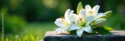 Freshly cut white lilies on a simple stone tomb, memorial flowers, funeral flowers