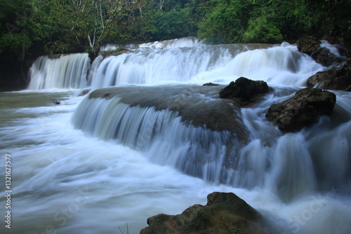 Pa La Tha Waterfall is a beautiful limestone waterfall. Its highlight is the waterfall's long width, clearly descending into 3 levels.  It is most beautiful during the rainy season.
Umphang ,THAILAND
