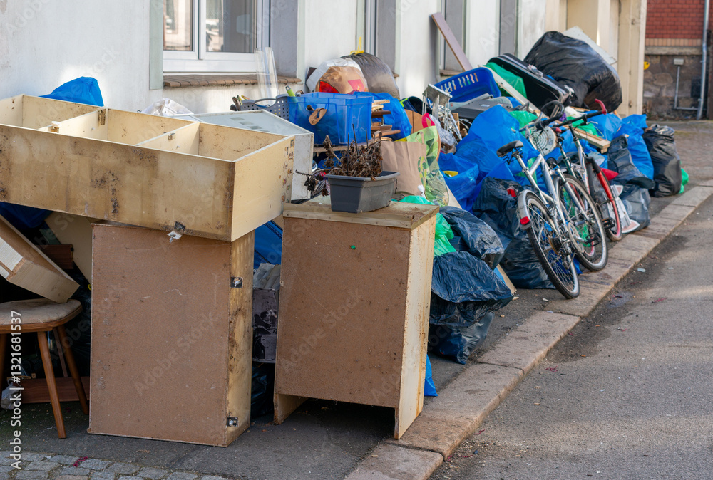 Household clearance for bulky waste with garbage bags on the street to be picked up