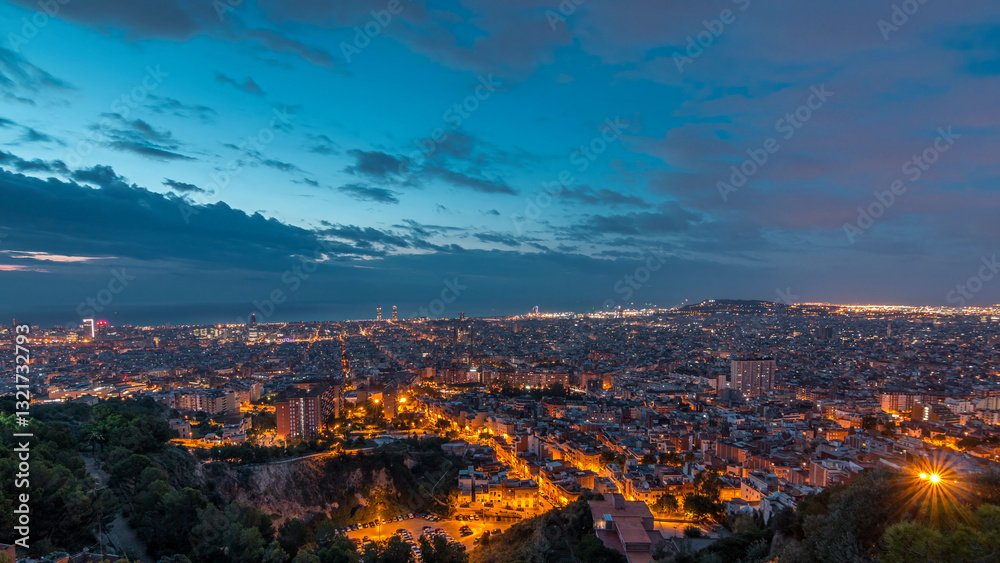 Obraz premium Panorama of Barcelona night to day timelapse, Spain, viewed from the Bunkers of Carmel