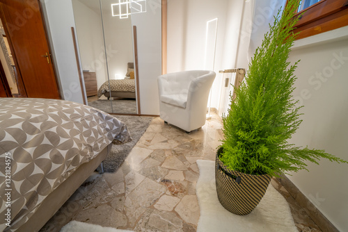 Obraz na płótnie Sleek and luxurious bedroom with soft lighting and large mirrors w salonie