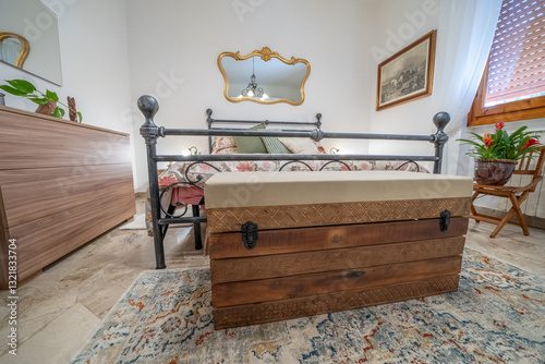 Vintage bedroom with classic wooden furniture in a rental home