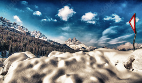 Obraz na płótnie Mountain peak and snowy valley in winter season against a beautiful sunny blue sky w salonie