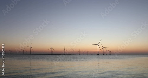 Wallpaper Mural Windturbines in the water during sunset. Producing alternative energy. Torontodigital.ca