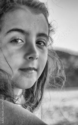 Obraz na płótnie Young girl feeling the sea breeze while sailing on a boat in paradise w salonie