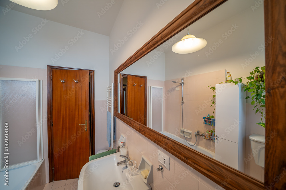 Contemporary bathroom with sleek design and sunlight streaming in