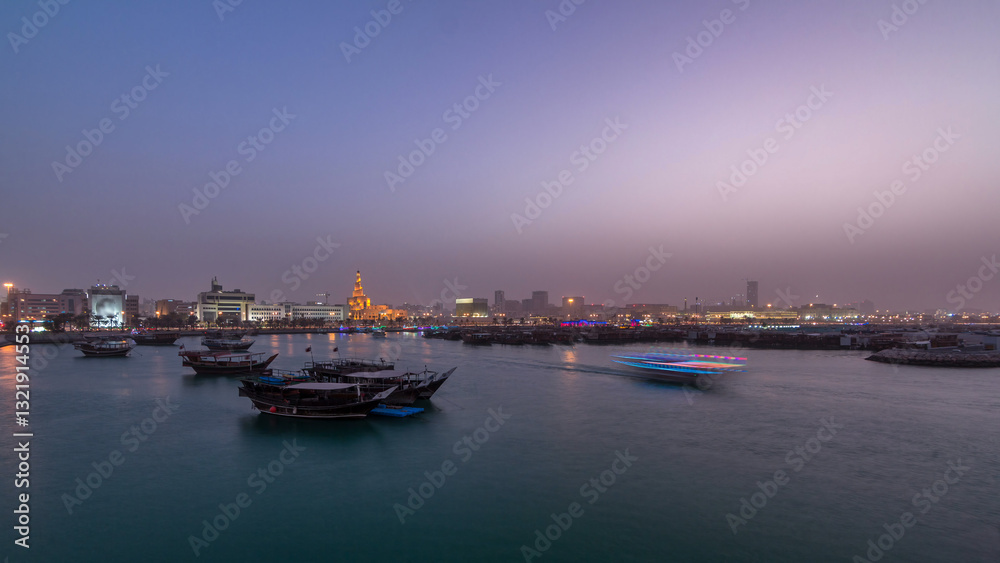 Naklejka premium Evening at Doha Bay day to night timelapse with Traditional Wooden Dhow Fishing Boats.
