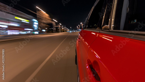 Drivelapse from side of car moving on a night avenue in city timelapse hyperl...