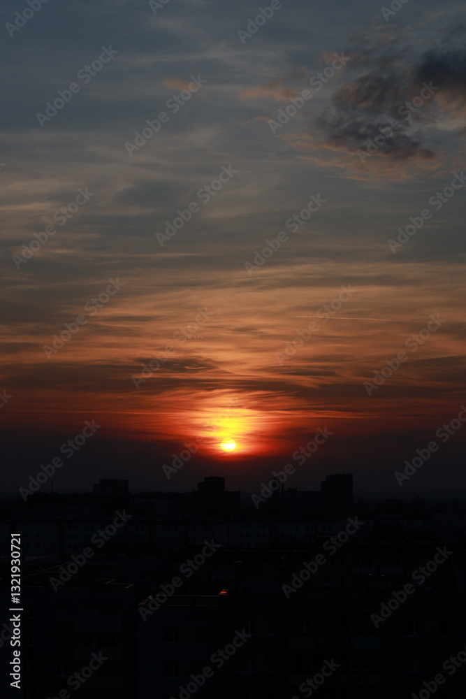 A romantic evening with a view of a beautiful sunset with a bird's height. The silhouette of the sun in the clouds. A romantic evening with a view of a beautiful sunset with a bird's height. The silhouette of the sun in the clouds.
