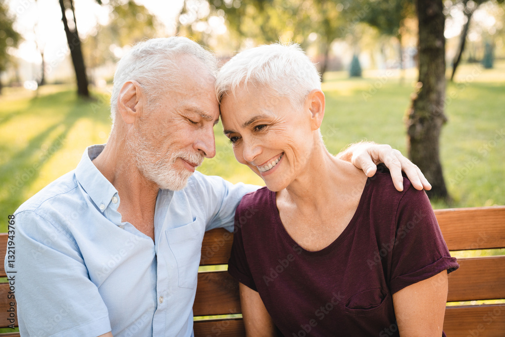 Senior couple laughing on park bench in nature garden for love, support or bonding retirement trust. Smile woman elderly man in backyard for joke funny news mature relationship Senior couple laughing on park bench in nature garden for love, support or bonding retirement trust. Smile woman elderly man in backyard for joke funny news mature relationship
