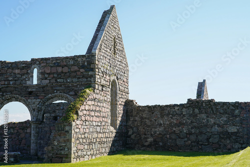 The ruins of the Iona Nunnery. The ruins are the most complete remains of a medieval nunnery in Scotland and are on the small Hebridean island of Iona. photo